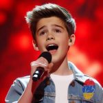 The boy sang the famous singer’s song so well that the judges couldn’t help but dance in their seats