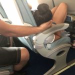 Dad sparks online debate after cradling daughter’s head for 45 minutes so she could sleep during a flight